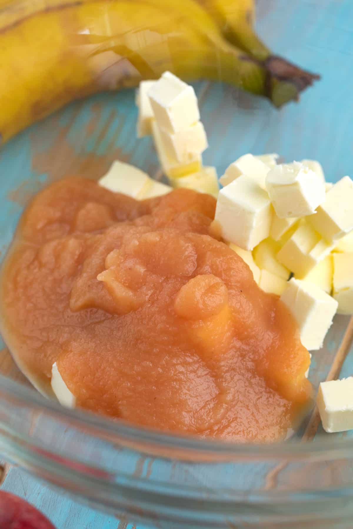 butter and applesauce in a bowl before mixing for banana oatmeal chocolate chip cookies