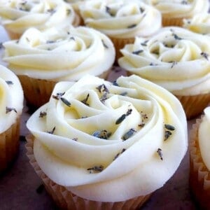 a lavender lemon cupcake with fresh lavender on top