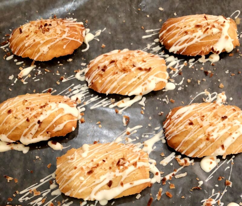 baked coconut madeleines with white chocolate and toasted coconut