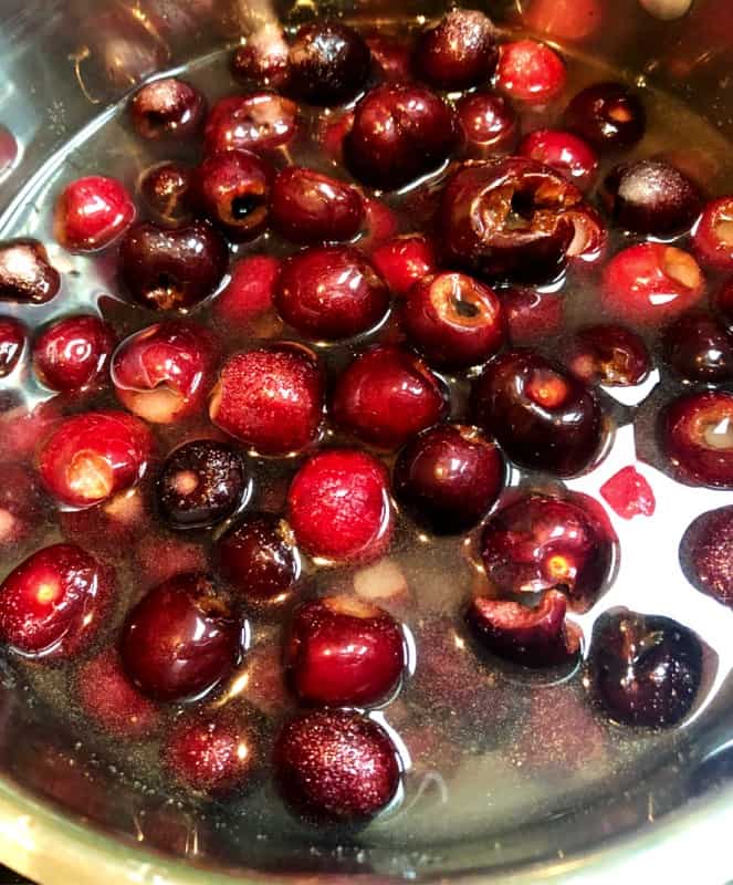 cherries in a pan for cherry syrup