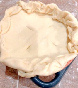 chicken pot pie with puff pastry before baking