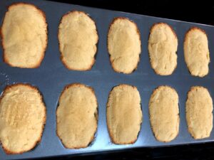 coconut madeleines baked in a pan