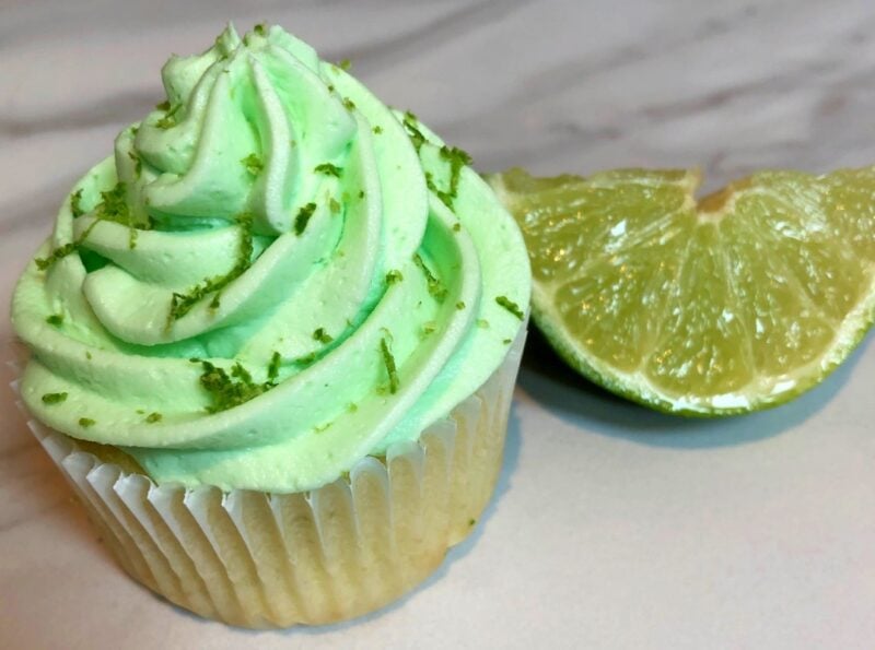 coconut margarita cupcake  and a lime wedge.