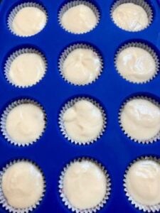 cupcake batter in pan for strawberry cheesecake cupcakes