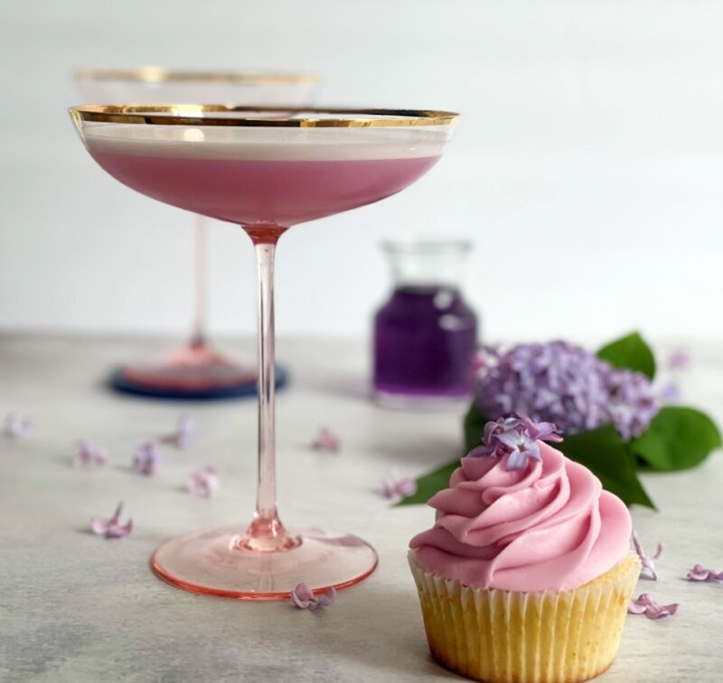 lilac cocktail and a lilac cupcake with fresh lilac flowers