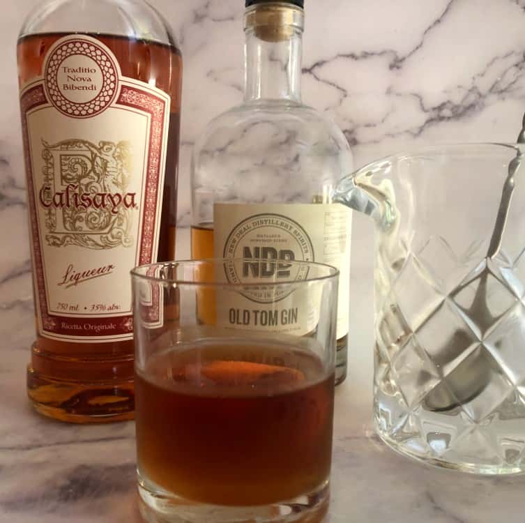modern negroni with old tom gin, calisysa and mixing glass with spoon