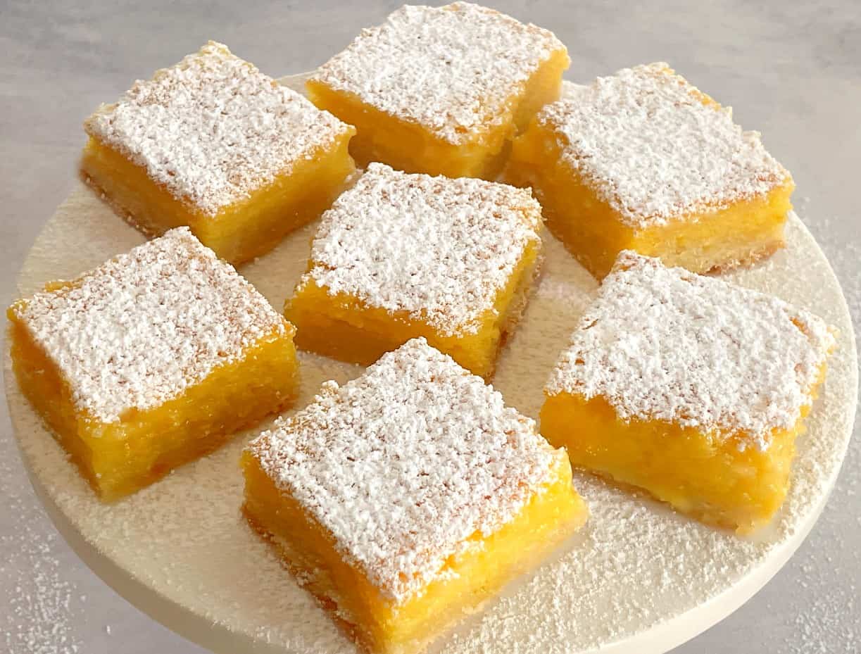passion fruit bars on a cake plate.