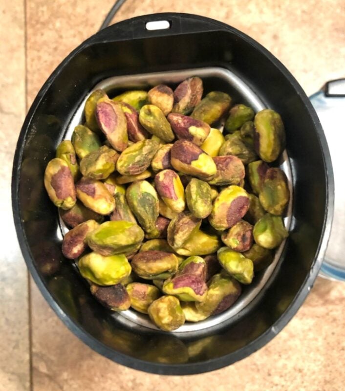 pistachios in small coffee grinder to make pistachio flour or paste