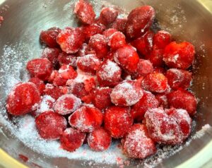 strawberries and sugar in a bowl