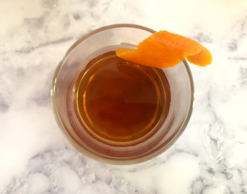 top view of modern negroni cocktail with an orange twist
