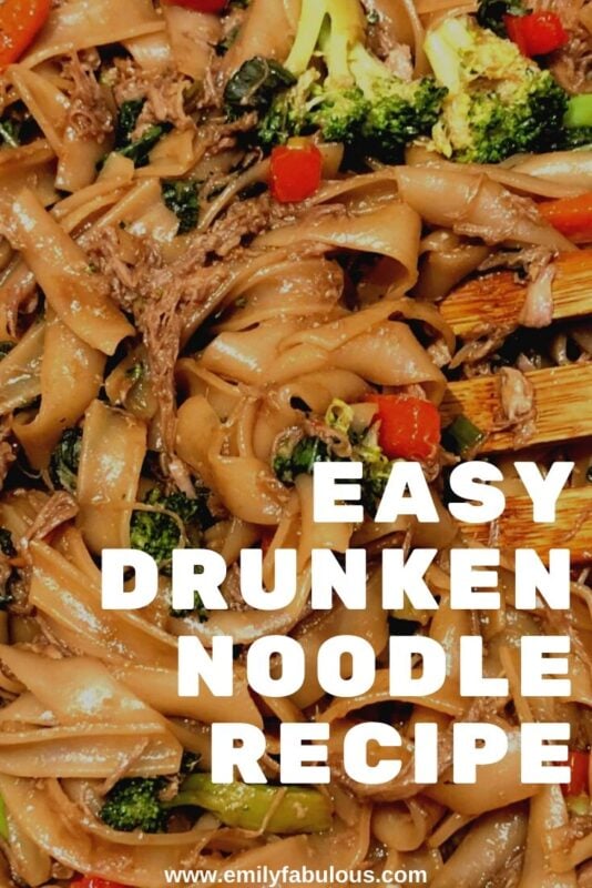 close up of pork drunken noodles with fresh vegetables