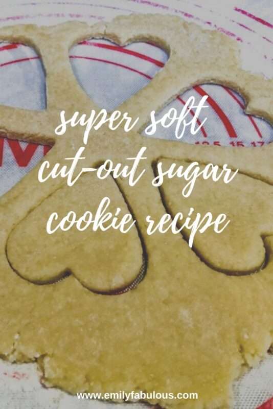 super soft sugar cookie dough rolled out with heart shapes cut out.