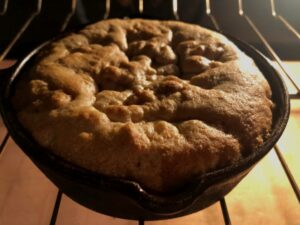 kitchen sink cookie in a cast iron skillet in oven