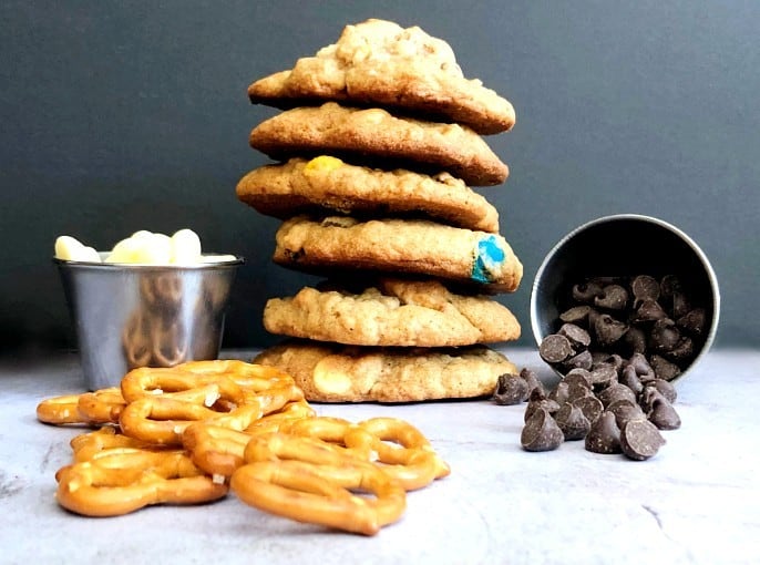 kitchen sink cookies stacked made with with pretzels and chocolate chips
