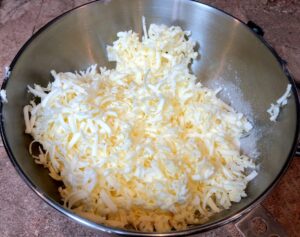 grated butter in a bowl for pie crust