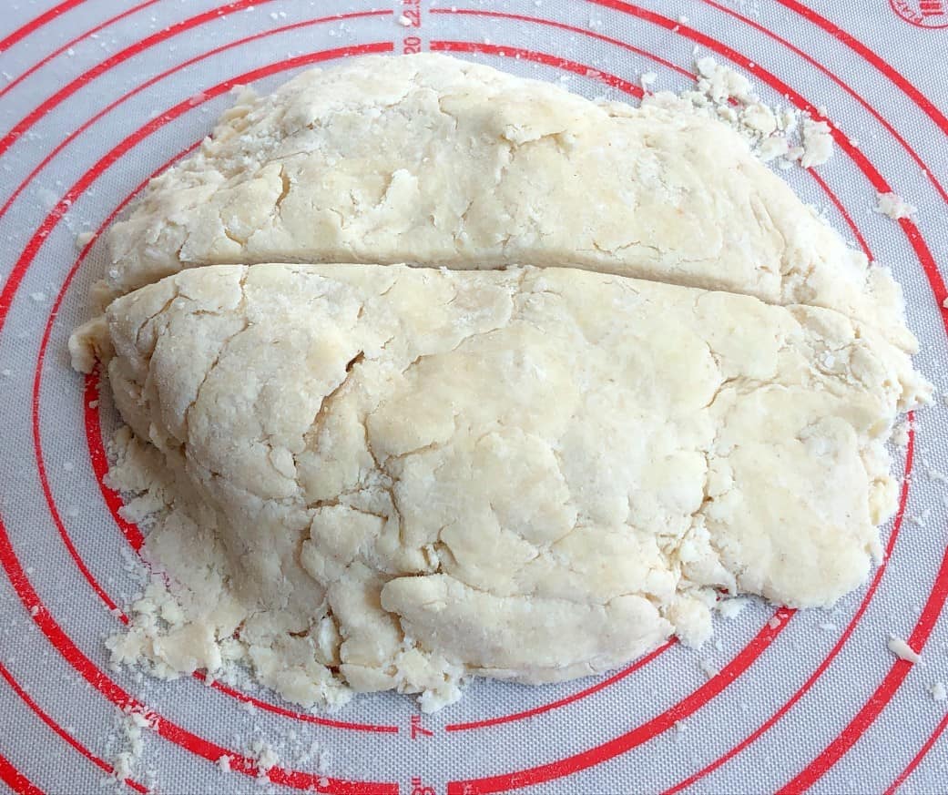 pie crust dough cut in half.