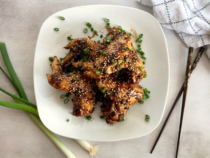 baked asian chicken wings with green onion and sesame seeds