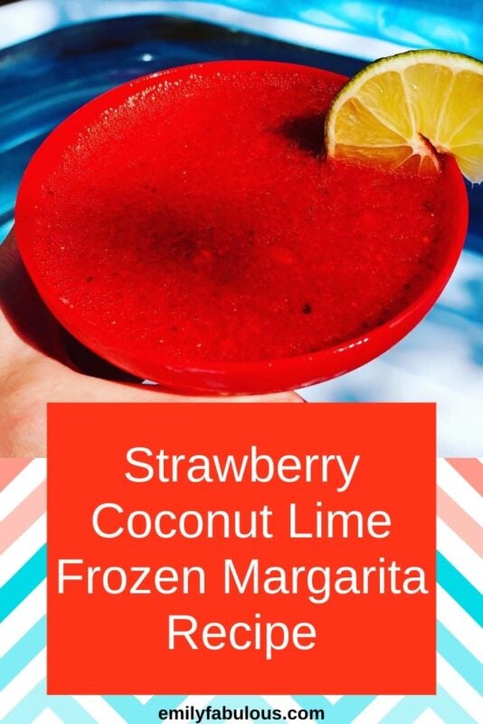 Strawberry Coconut Frozen Margarita with a lime wedge