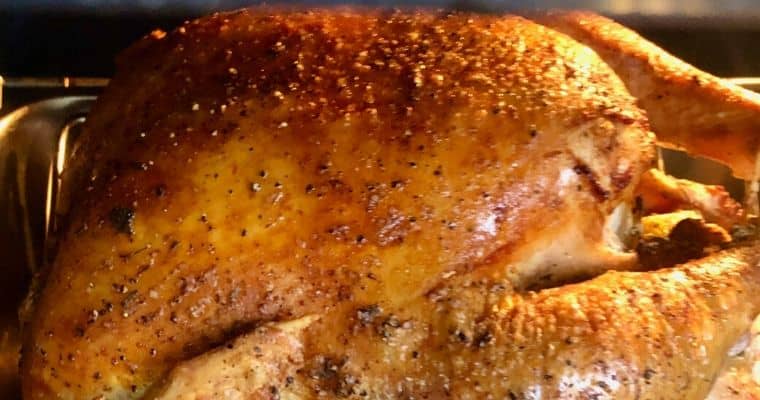dry brined roasted turkey in the oven