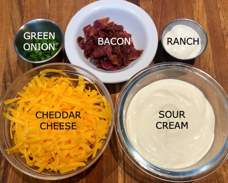 baked potato tater tot ingredients: sour cream, cheddar cheese, bacon, green onion, ranch dressing