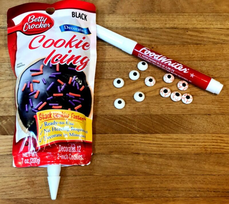 cookie icing, red edible marker, candy eyeballs.