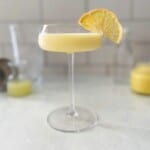 lemon curd cocktail in a coupe glass.
