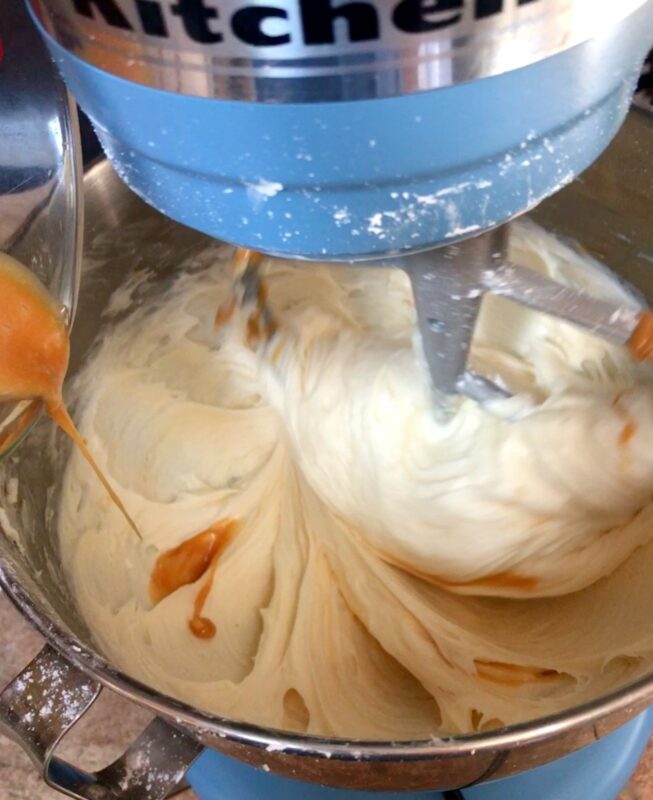 caramel being mixed in to apple caramel frosting