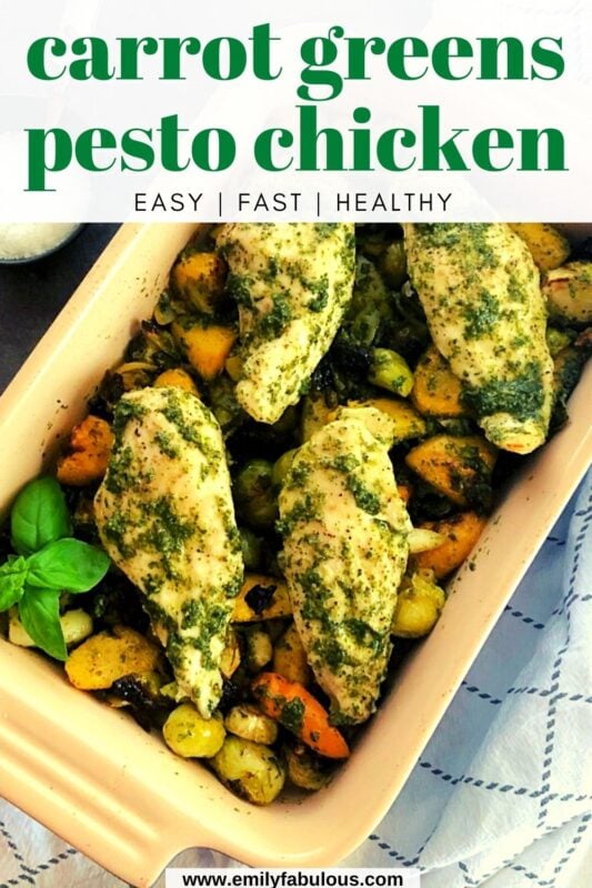 chicken and roasted veggies with carrot greens pesto in a baking dish
