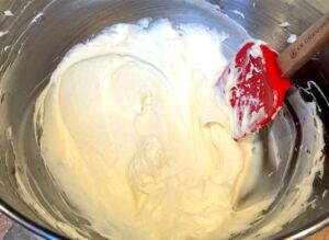 cream cheese frosting for pumpkin bread in a bowl