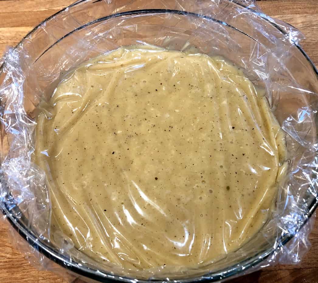 gravy base in a bowl covered in plastic wrap.