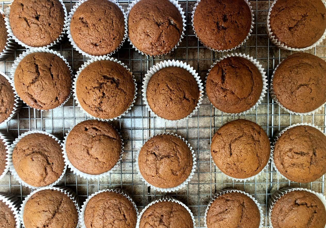 pumpkin molasses cupcakes on a cooling rack.