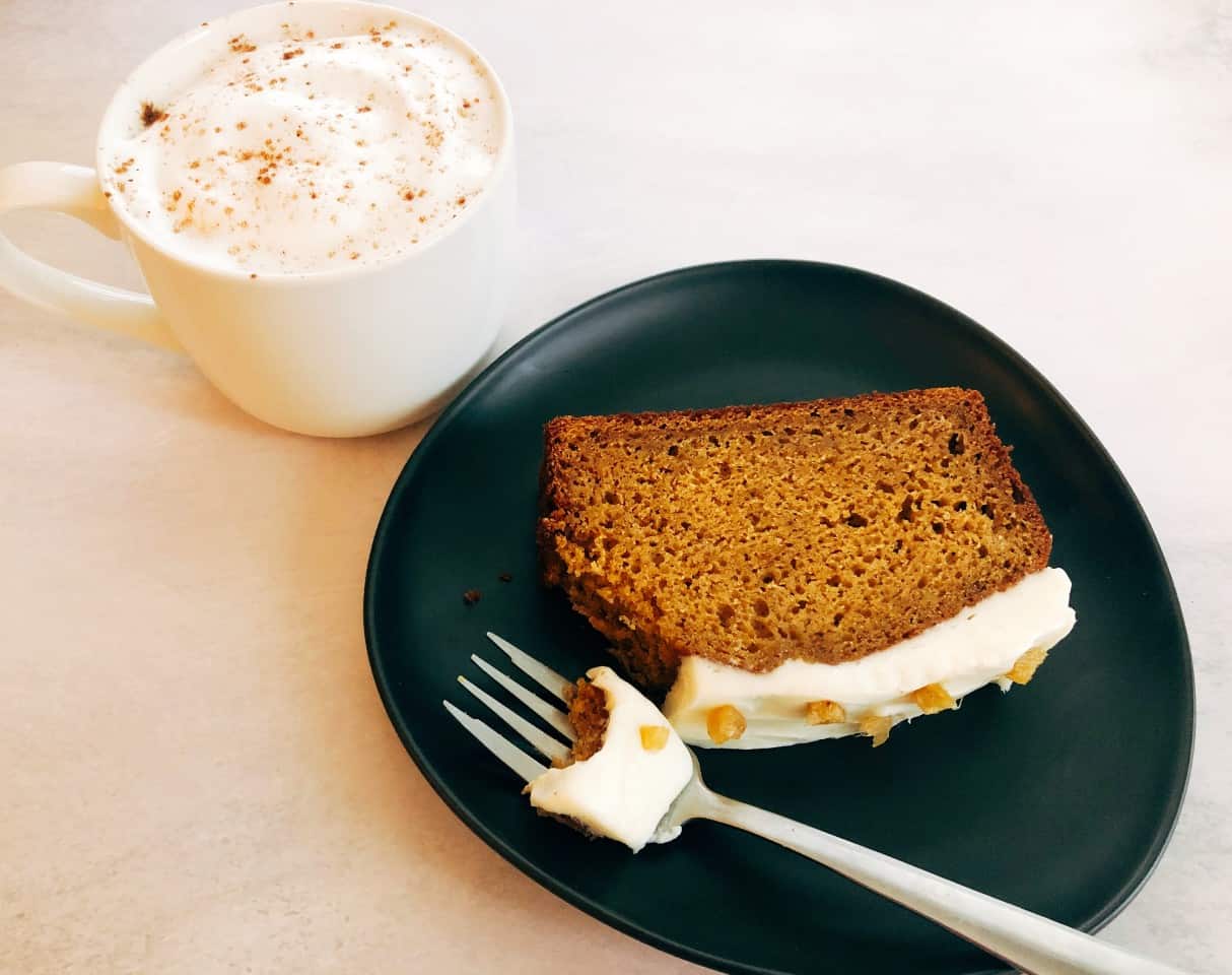 slice of pumpkin bread and a latte