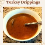 turkey dripping gravy in a bowl with a spoon