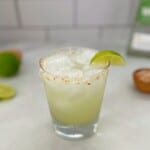 coconut lime margarita with a lime wedge