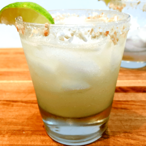 coconut tequila margarita with lime wedge