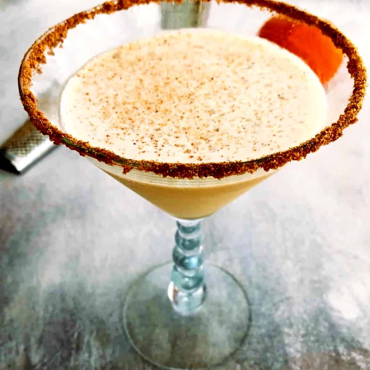 pumpkin spice martini with a graham cracker rim