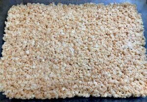 rice krispie treats pressed into a pan