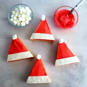 rice krispie santa hats with frosting and marshmallows