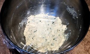 Rosemary quick bread dough covered to rise