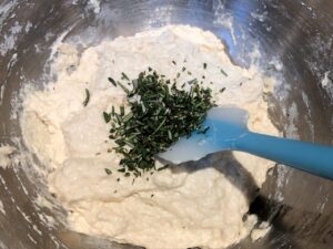 chopped rosemary added to quick bread dough