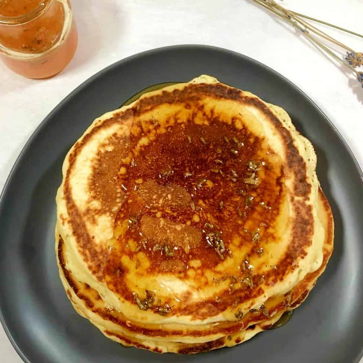 pancakes with lavender honey on a plate.