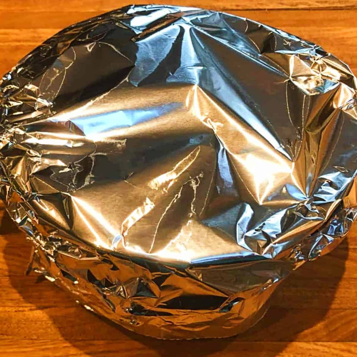 pan with cranberries wrapped in foil.