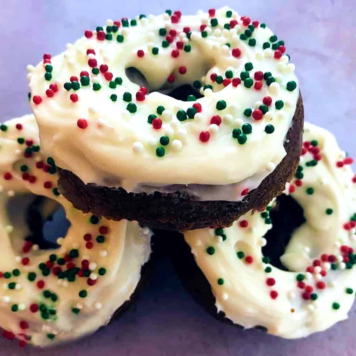 a stack of gingerbread donuts with frosting