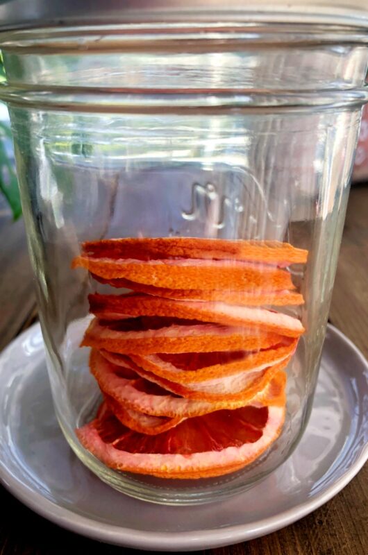 dehydrated oranges in a glass jar