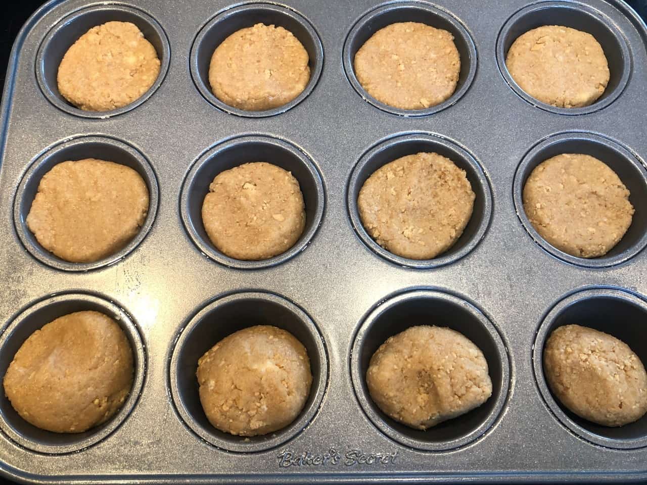 graham cracker dough in a mini cupcake pan.