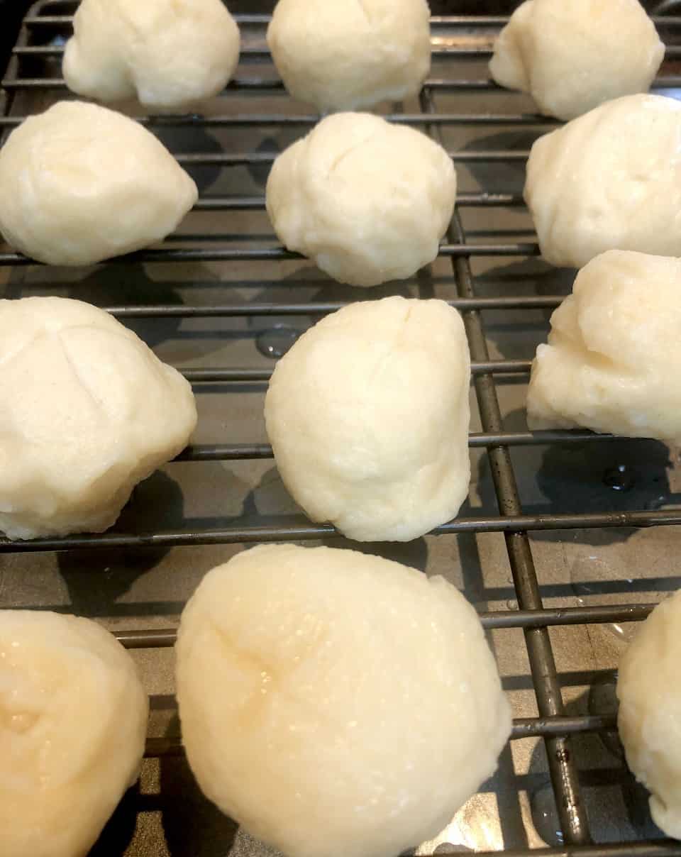 raw pretzel rolls after boiling in baking soda water.