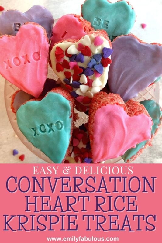 conversation heart rice krispie treats with sprinkles and candy coating on a cake plate
