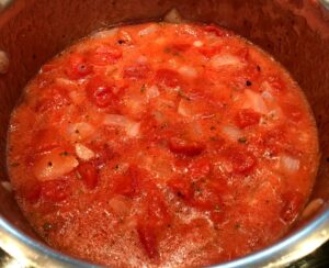 tomatos in onions and butter for soup