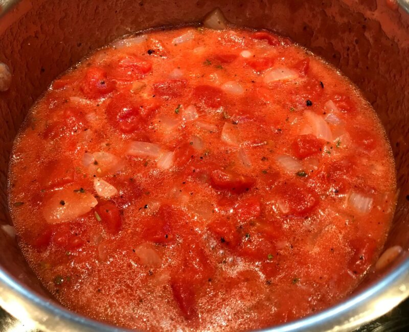 tomatos in onions and butter for soup