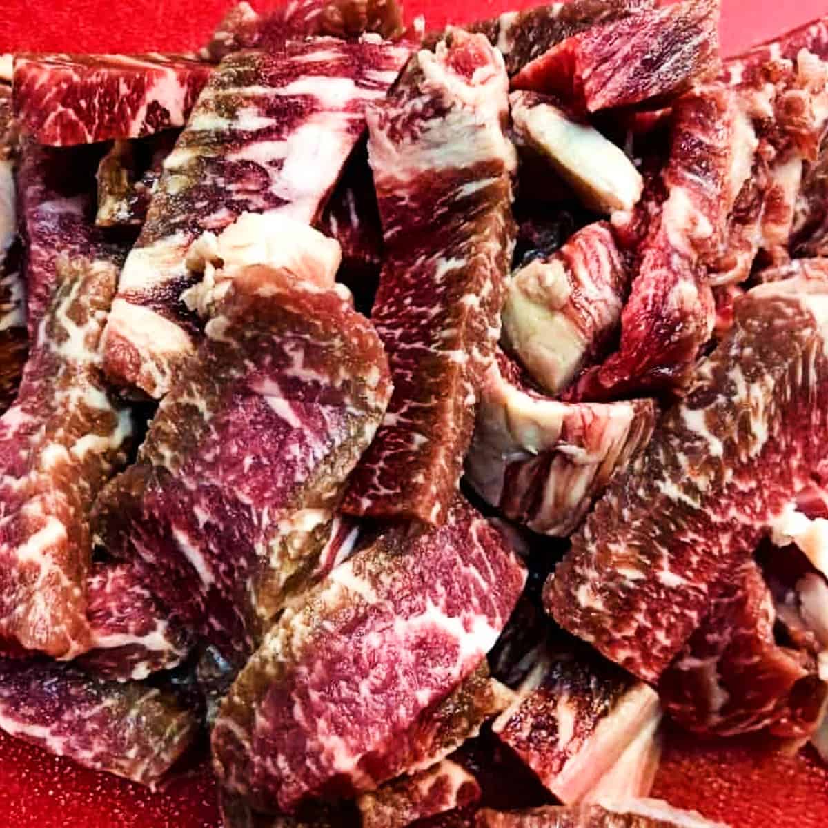 sliced beef on a cutting board.